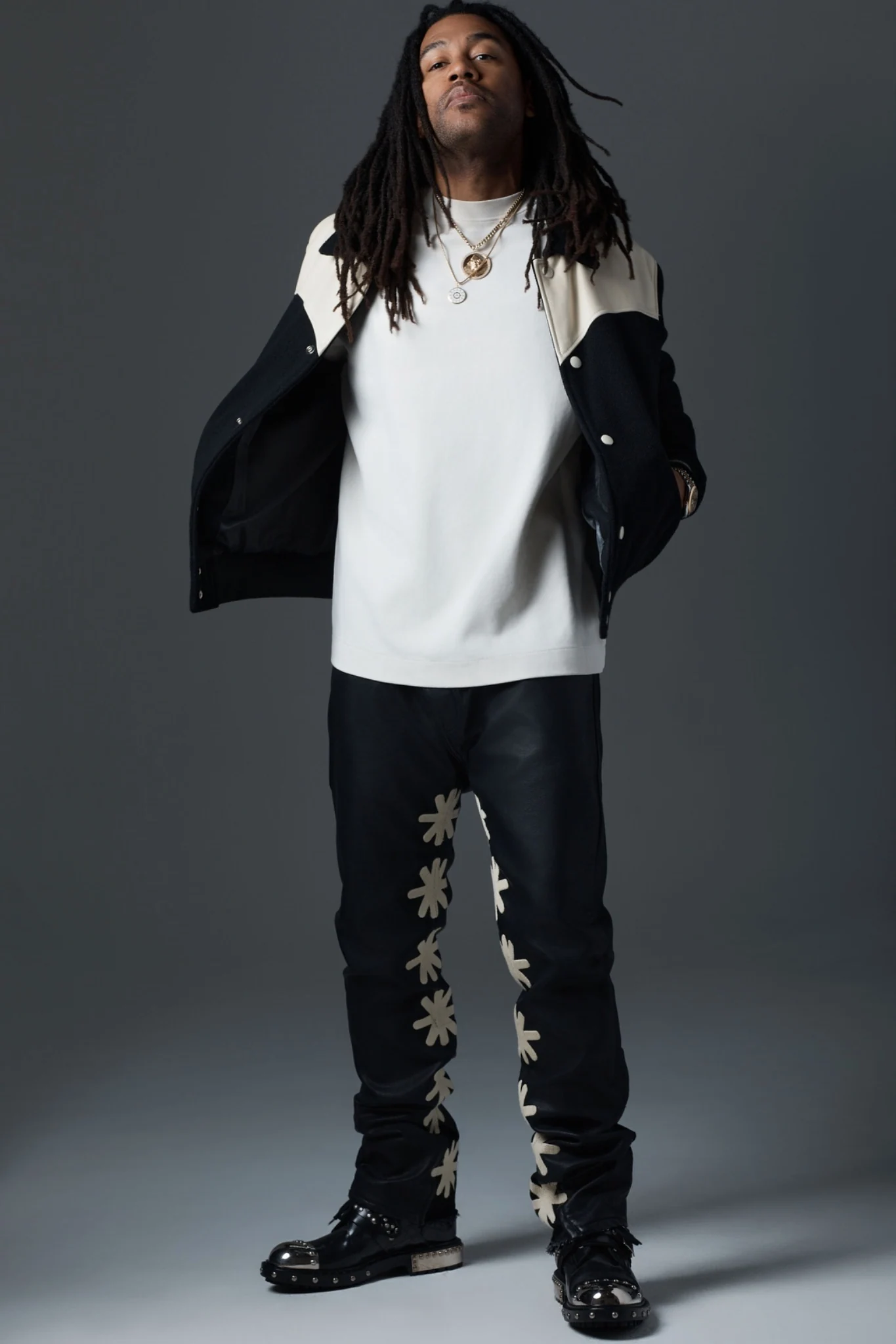 Nick Brooks in a full-body studio portrait