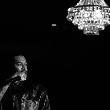 Ben Kenobe performing with a microphone